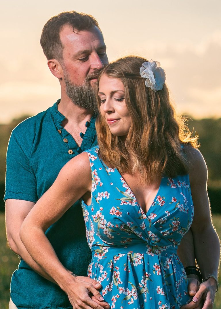 This image shows an embrace between Maria and Gareth during their engagement photoshoot at sunset.